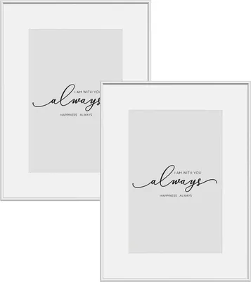 Two silver metal picture frames with white mats and printed text on a white background.