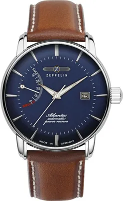 A close-up studio shot of a men's wristwatch with a blue dial and a brown leather strap.