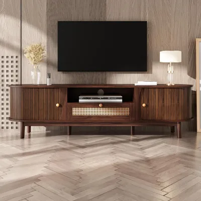 A TV stand with a TV mounted above it in a living room setting.