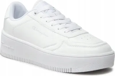 A white platform sneaker is shown from a side-angle against a white background.