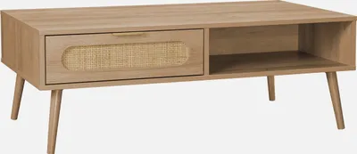 A light brown wooden coffee table with a drawer and an open shelf, set against a light gray background.