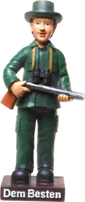 A figurine of a hunter holding a rifle and binoculars, standing on a base with text.