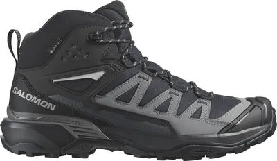 A side view of a black and gray Salomon hiking boot.