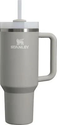A gray Stanley tumbler with a straw and handle, shown against a white background.