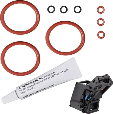 A collection of various rubber O-rings, a tube of grease, and a mechanical component, laid out on a white background.