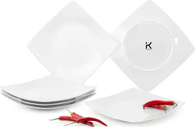 A set of square white plates with red chili peppers.