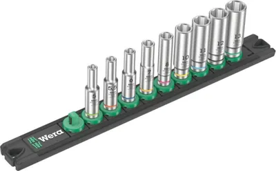 A set of socket wrenches on a black magnetic strip.