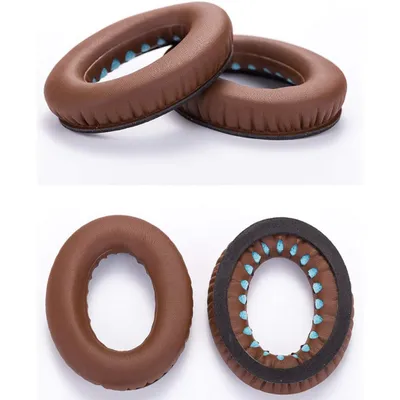 Two pairs of brown leather ear pads for headphones are shown against a white background. One pair is stacked on top of the other, and the bottom pair is shown from the side, revealing the inner blue cushioning.