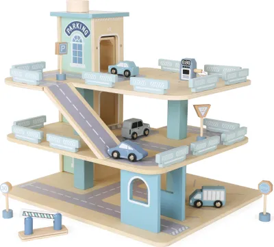 A wooden toy parking garage with several toy cars and accessories.