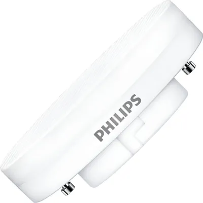A close-up, angled view of a white Philips LED lamp with its pins visible.