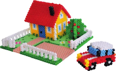A toy house, tree, and car made of small beads, set on a green and pink base.