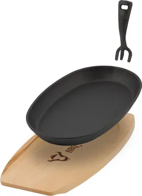 Obrázek produktu pro Litinová servírovací pánev s dřevěnou trojnožkou - Oválná 27 x 18 cm - Předpečeno a žáruvzdorné