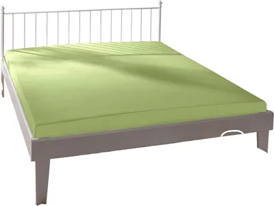 A bed with a light green fitted sheet.