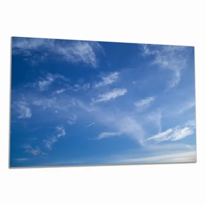 Produktbild von Wallario Herdabdeckplatte aus Glas, Größe 80 x 52 cm 1-teilig, Motiv Blauer Himmel mit vereinzelten Wolken