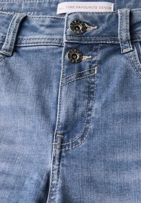 A close-up view of the button and zipper area of blue denim jeans.