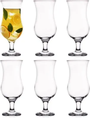 A set of six hurricane glasses, with one glass filled with a beverage and garnished with lemon slices and mint leaves.