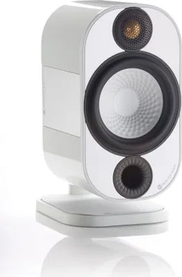 A white Monitor Audio Apex A10 compact speaker is shown on a white reflective surface against a white background.