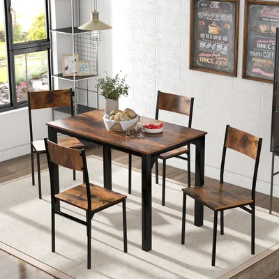 A dining set with a table and four chairs in a room with a window and wall decorations.