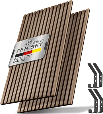 Two wooden acoustic panels are shown diagonally, with a metal plaque attached to one of them. Four black coat hooks are placed to the right of the panels.