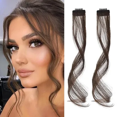 Image de Deux pièces de postiches de type "ponytail" synthétiques, longs de 30 cm, de couleur marron foncé avec des reflets cuivrés