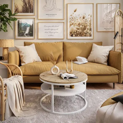 A living room scene with a yellow sofa, coffee table, and wall art.