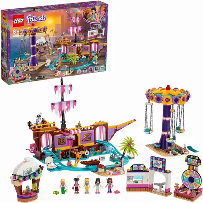 A LEGO Friends amusement park set, including a pirate ship ride, a carousel, and other attractions, displayed with its packaging.