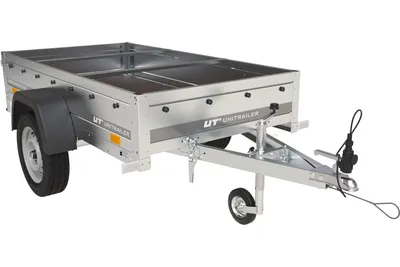 A silver utility trailer with a black fender and a black tarp is shown against a white background.