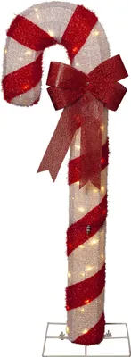 A lit-up candy cane decoration with a red bow.