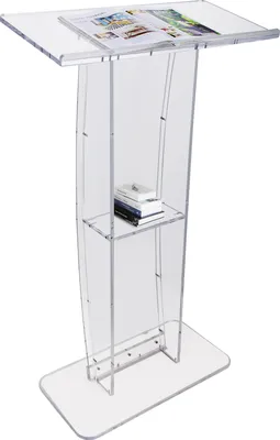 A clear acrylic podium stand with a magazine on top and books on a shelf.