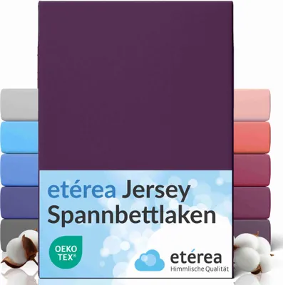 A stack of folded jersey bed sheets in various colors, with the main product in a deep purple color prominently displayed.