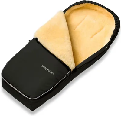 A black baby footmuff with a cream-colored fluffy interior, laid open on a white background.