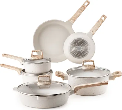 A collection of white cookware with wooden handles is arranged on a white background.