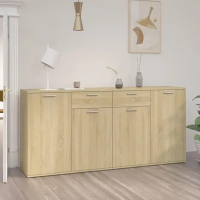 A modern sideboard with drawers and doors, set against a neutral wall with a piece of abstract art and a lamp.