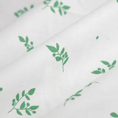 Imagen del producto de Popelina de algodón orgánico, estampado de lunares, colores verde y beige