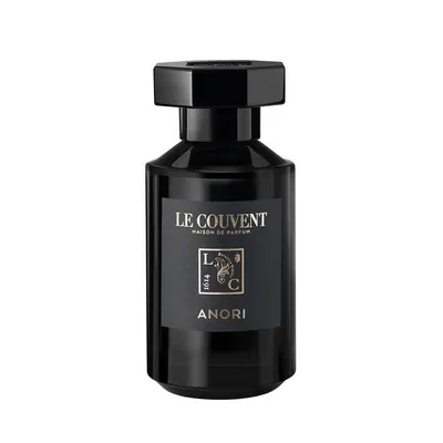 A black bottle of perfume on a white background.