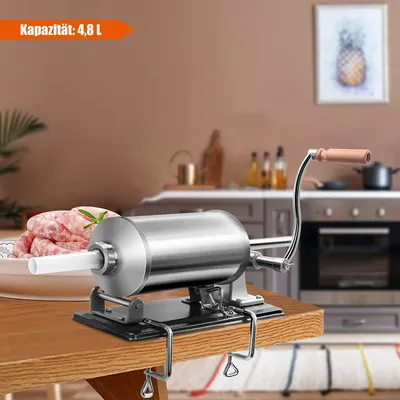 A sausage stuffer is shown on a wooden table in a kitchen setting.