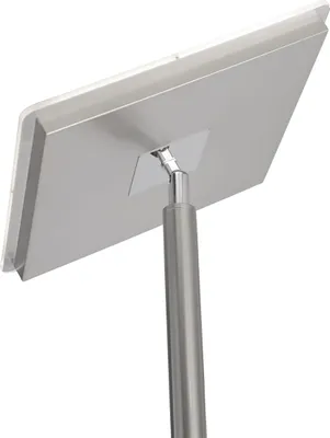 A close-up, angled view of the back of a modern LED floor lamp with a square head and a metal pole.