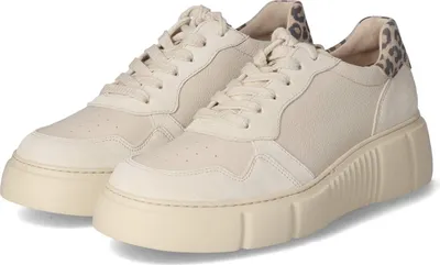 A pair of beige sneakers with a leopard print accent on the heel.