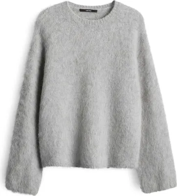 A grey fuzzy sweater is laid flat against a white background.