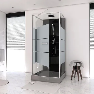 A modern bathroom with a large glass shower enclosure.