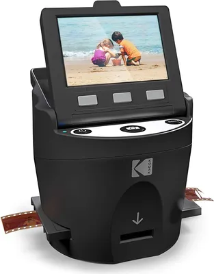 A Kodak film scanner with a screen displaying a photo of two children on a beach.