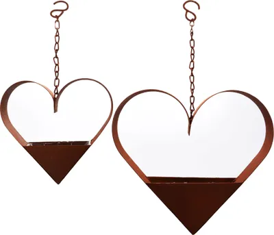 Two heart-shaped hanging planters with a rustic, rusted metal look.