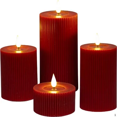 Four red LED candles of varying sizes are arranged on a white background.