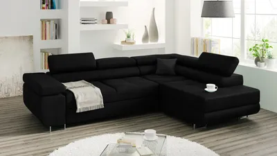 A black sectional sofa in a modern living room setting.