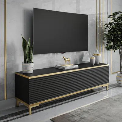 A modern living room with a TV stand and television.
