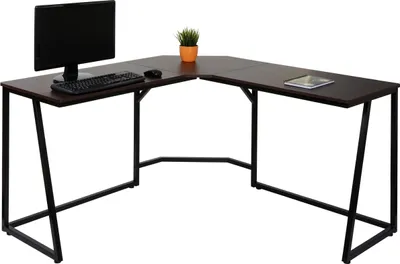 A dark brown L-shaped desk with black metal legs, shown from a slightly elevated angle against a white background. A computer monitor, keyboard, mouse, a small potted plant, and a tablet are placed on the desk.
