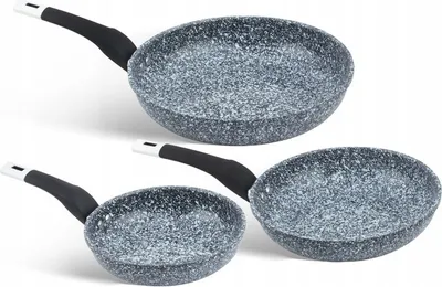 Three frying pans of different sizes are arranged diagonally on a white background.