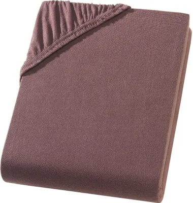 A folded fitted sheet with elastic corners.