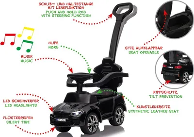 A black ride-on car with various features highlighted by text annotations.