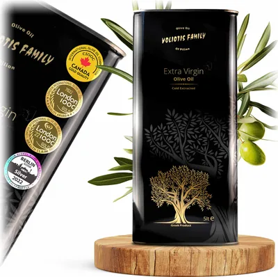 A large black tin of olive oil is displayed on a wooden stand, surrounded by olive branches.